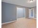 The bedroom features light vinyl flooring, neutral paint, ceiling light and closet space at 163 W Lillington St, Angier, NC 27501