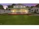 Charming two-story home with a welcoming front porch and a well-maintained lawn at 163 W Lillington St, Angier, NC 27501