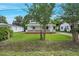 Charming two-story home with white siding, a covered porch, and a lush green lawn at 163 W Lillington St, Angier, NC 27501