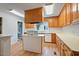 Charming kitchen featuring wood cabinets, laminate countertops, and a bright, airy atmosphere at 163 W Lillington St, Angier, NC 27501