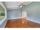 Bright living room featuring hardwood floors, vaulted ceilings, and large windows at 163 W Lillington St, Angier, NC 27501