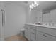 Bathroom featuring double sink vanity, white cabinets, and neutral tile flooring at 165 Hickory Grv Dr, Sanford, NC 27330