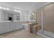 Bathroom with double sinks, soaking tub, glass shower and a light and airy atmosphere at 165 Hickory Grv Dr, Sanford, NC 27330