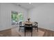 Cozy dining area with a round table, black chairs, and sliding glass doors to the patio at 165 Hickory Grv Dr, Sanford, NC 27330