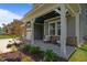 Cozy front porch with comfortable seating and decorative plants, offering a relaxing outdoor space at 165 Hickory Grv Dr, Sanford, NC 27330