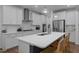 A modern kitchen with white countertops, a large island, and stainless steel appliances at 165 Hickory Grv Dr, Sanford, NC 27330