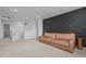 Finished living room with accent wall, neutral carpet, and large bright window at 165 Hickory Grv Dr, Sanford, NC 27330