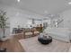 Bright living space featuring contemporary decor, a dining area, and a view of the kitchen at 165 Hickory Grv Dr, Sanford, NC 27330