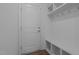 Well-organized mudroom entry with bench seating, hooks, and overhead storage shelves at 165 Hickory Grv Dr, Sanford, NC 27330