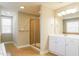 This bathroom features a glass shower, double sink vanity, and a large window at 165 Sutherland Dr, Franklinton, NC 27525