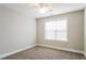 This bright bedroom includes neutral walls, carpeting and a ceiling fan at 165 Sutherland Dr, Franklinton, NC 27525