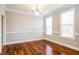Elegant dining room features hardwood floors, crown molding, and lots of natural light at 165 Sutherland Dr, Franklinton, NC 27525