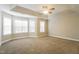 Spacious main bedroom featuring vaulted ceiling, neutral carpet and large windows for ample natural light at 165 Sutherland Dr, Franklinton, NC 27525