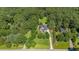 Aerial view of estate featuring lush tree coverage, manicured lawn, and home at 1809 Bowling Rd, Fuquay Varina, NC 27526