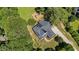 This aerial shot showcases a home with solar panels, a well-manicured lawn, and a playground at 1809 Bowling Rd, Fuquay Varina, NC 27526