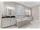 Elegant bathroom with double vanity, soaking tub, and contemporary finishes at 1809 Bowling Rd, Fuquay Varina, NC 27526