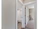 View of the bathroom with a tub-shower combo and view into a bedroom at 1809 Bowling Rd, Fuquay Varina, NC 27526