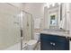 Bathroom featuring a glass-enclosed shower, granite countertop vanity, and neutral color scheme at 1809 Bowling Rd, Fuquay Varina, NC 27526