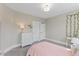 Bedroom featuring neutral walls, carpet, a bed, desk, dresser, and closet at 1809 Bowling Rd, Fuquay Varina, NC 27526