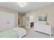 Bedroom featuring neutral walls, carpet, a closet, and ensuite bathroom view at 1809 Bowling Rd, Fuquay Varina, NC 27526