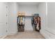 Walk-in closet features ample storage space and custom shelving for optimal organization at 1809 Bowling Rd, Fuquay Varina, NC 27526