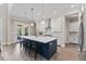 Spacious kitchen featuring a large island with seating, modern appliances, and an open layout to the living area at 1809 Bowling Rd, Fuquay Varina, NC 27526