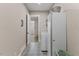 Bright laundry room boasts patterned tile, washer and dryer, and ample storage at 1809 Bowling Rd, Fuquay Varina, NC 27526