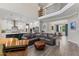 Open living room featuring a couch, hardwood floors, and a view to the kitchen at 1809 Bowling Rd, Fuquay Varina, NC 27526