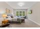 Bright primary bedroom with large windows, decor, and cozy furniture at 1809 Bowling Rd, Fuquay Varina, NC 27526