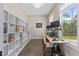 Bright office featuring custom built-ins, wood floors, and great natural light at 1809 Bowling Rd, Fuquay Varina, NC 27526