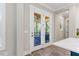 View of screened patio from the kitchen offers seamless indoor-outdoor living at 1809 Bowling Rd, Fuquay Varina, NC 27526