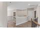 Open and airy upstairs hallway with hardwood floors and iron railing detail at 1809 Bowling Rd, Fuquay Varina, NC 27526