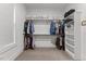 Spacious walk-in closet featuring custom shelving, rods, and ample storage space at 1809 Bowling Rd, Fuquay Varina, NC 27526