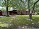 Charming brick home featuring a lovely front yard and covered porch at 194 John Mitchell Rd, Youngsville, NC 27596