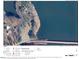 An aerial view shows the property's proximity to the lake and surrounding trees at 2011 Bowmantown Rd, Roxboro, NC 27574