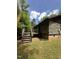 Rustic log cabin home showcasing a charming wooden deck and classic design at 2011 Bowmantown Rd, Roxboro, NC 27574
