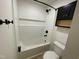 A clean, updated bathroom featuring modern fixtures and white tile at 205 Woodhaven Dr, Burlington, NC 27217