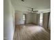 Spacious bedroom featuring hardwood floors, a ceiling fan, and bright natural light at 205 Woodhaven Dr, Burlington, NC 27217