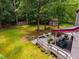 Expansive backyard features a large deck, seating, string lights and ample lawn space at 206 Lisa Dr, Carrboro, NC 27510