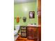 Cozy bathroom featuring a wooden vanity with basket drawers, and hardwood flooring at 206 Lisa Dr, Carrboro, NC 27510