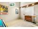 Bonus room with a vaulted ceiling, hardwood flooring, and a vintage storage chest at 206 Lisa Dr, Carrboro, NC 27510