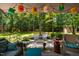 Outdoor deck provides seating, lighting and lush views of the well-maintained lawn, creating an inviting backyard space at 206 Lisa Dr, Carrboro, NC 27510