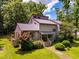 Charming two-story home with a well-maintained front yard and colorful landscaping at 206 Lisa Dr, Carrboro, NC 27510