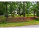 Charming two-story home nestled among mature trees with a well-manicured lawn at 206 Lisa Dr, Carrboro, NC 27510