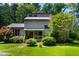 Charming two-story home with a well-maintained front yard and colorful landscaping at 206 Lisa Dr, Carrboro, NC 27510