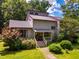 Charming two-story home with a well-maintained front yard and colorful landscaping at 206 Lisa Dr, Carrboro, NC 27510