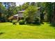 Charming two-story home with a well-maintained front yard and colorful landscaping at 206 Lisa Dr, Carrboro, NC 27510