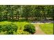 View of the front yard showcases lush greenery and a quiet street at 206 Lisa Dr, Carrboro, NC 27510