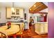Open kitchen leading to a cozy living space with beautiful hardwood floors and great natural light at 206 Lisa Dr, Carrboro, NC 27510