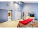 Bright main bedroom with carpet, featuring access to a bathroom, a walk in closet, and a closet at 206 Lisa Dr, Carrboro, NC 27510